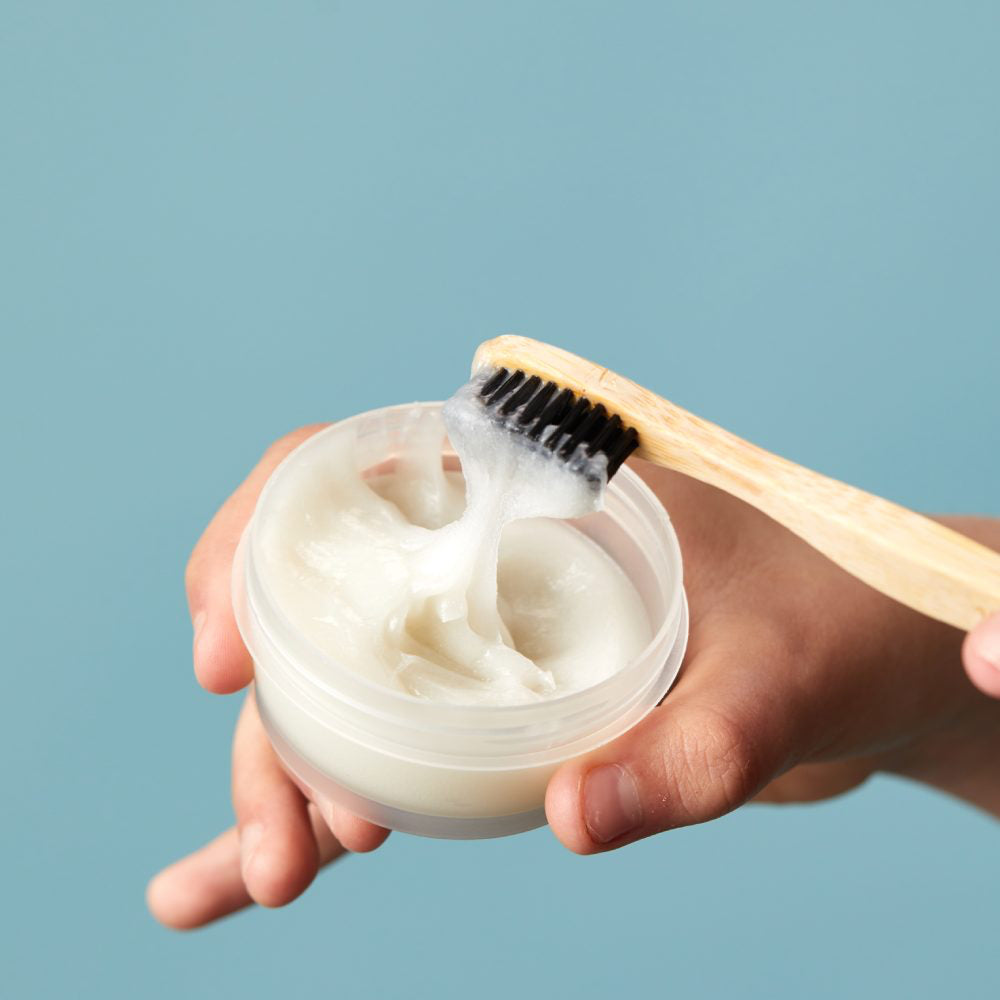 Toothbrush being dipped in Lush&