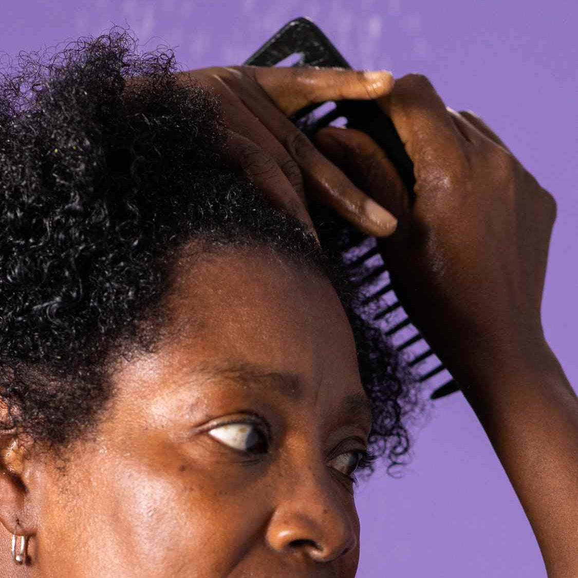 Woman combing her hair
