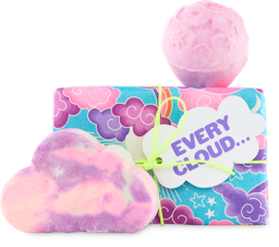Every Cloud. A rectangular box, wrapped in Akaya paper featuring pink and purple clouds, tied with yellow cord and a gift tag.