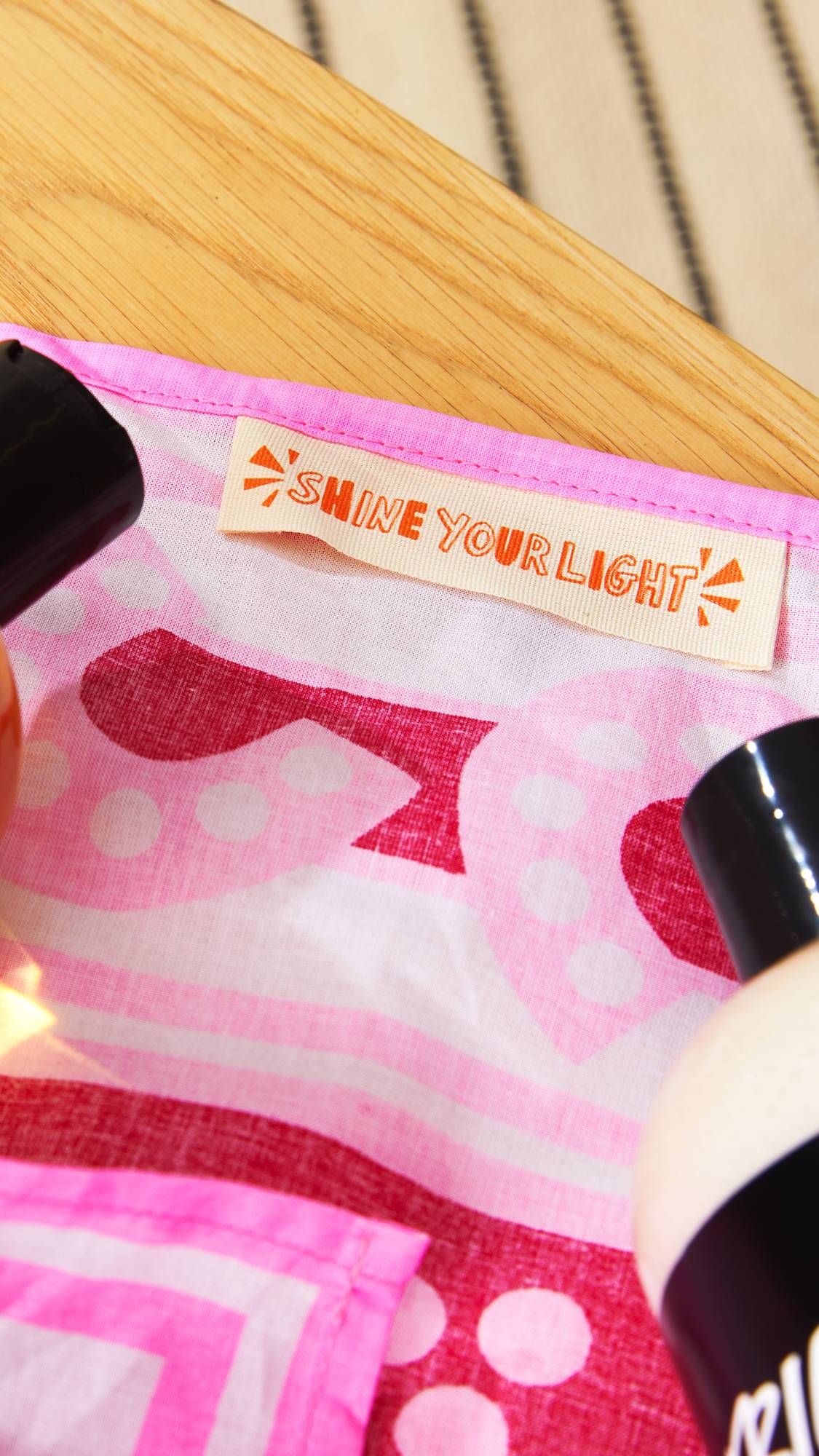 “Shine Your Light” stitched label visible inside Lush&