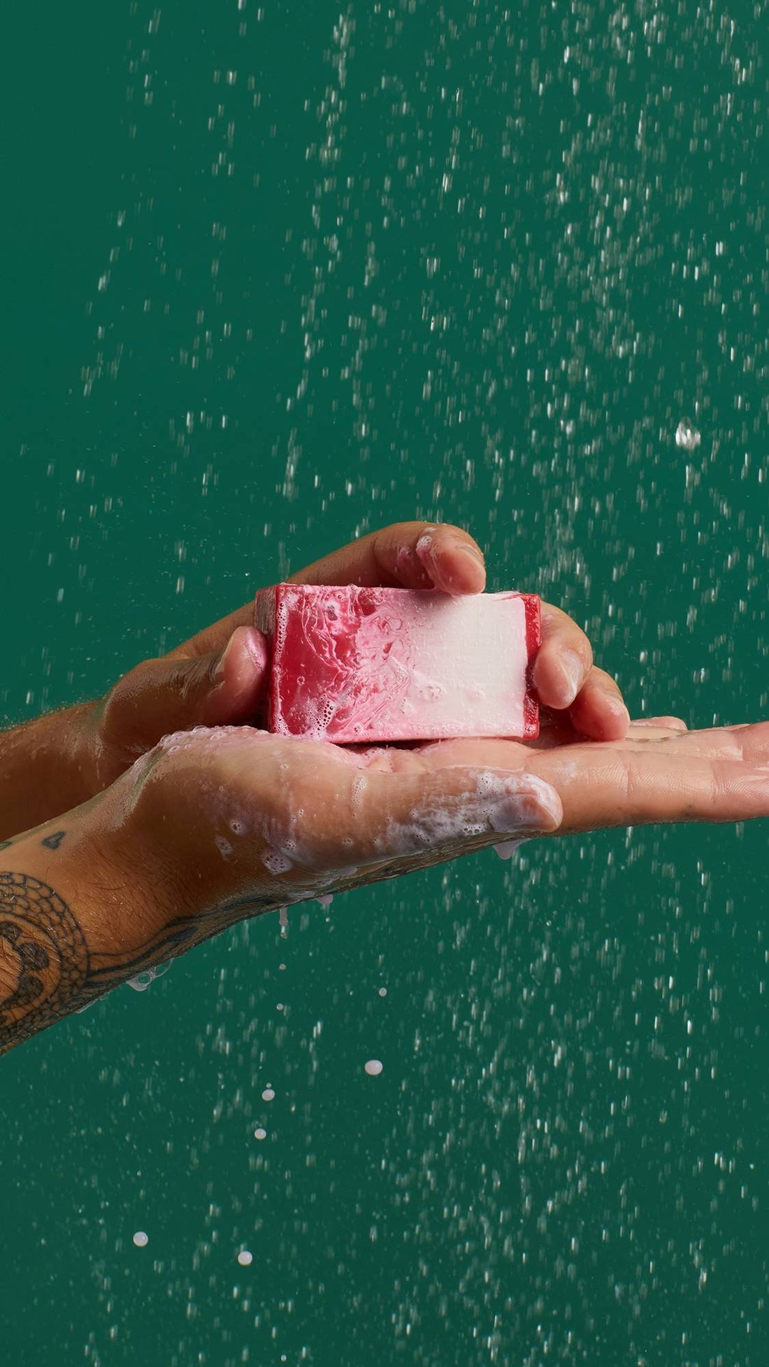 Men holding the pink soup from Lush the Comforter in his hand