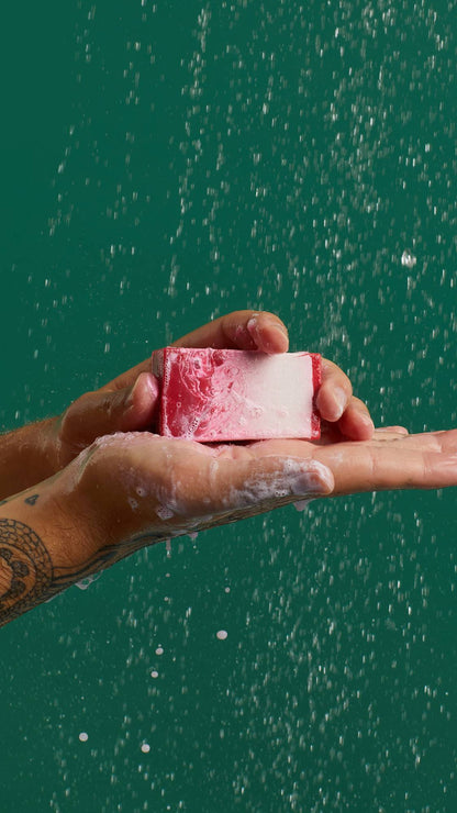 Men holding the pink soup from Lush the Comforter in his hand