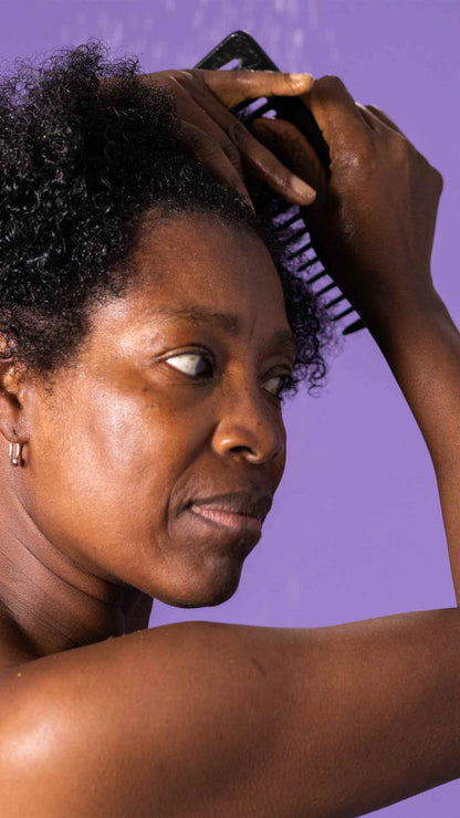 Woman combing her hair