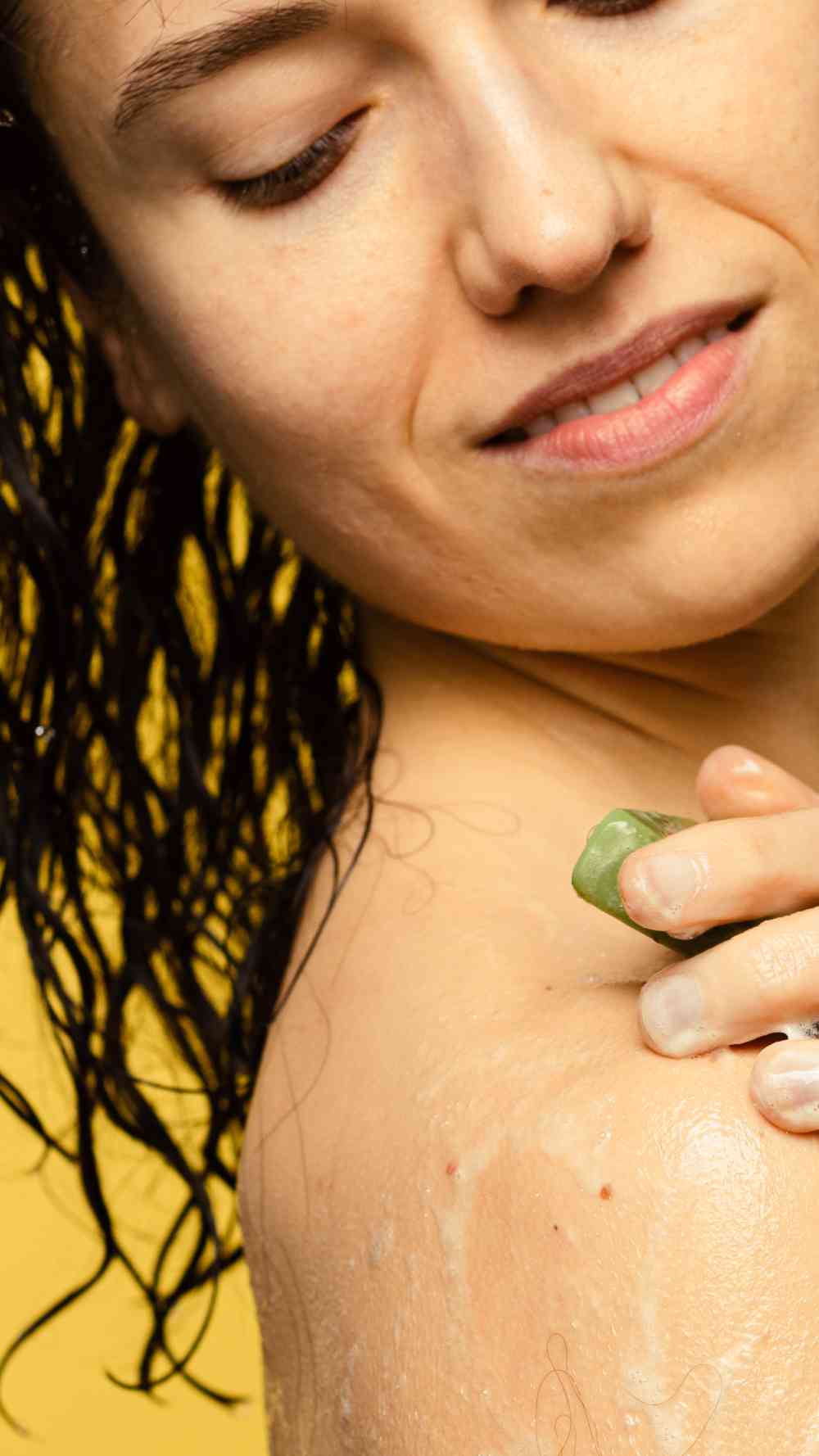 Lady scrubbing her body with Lush&