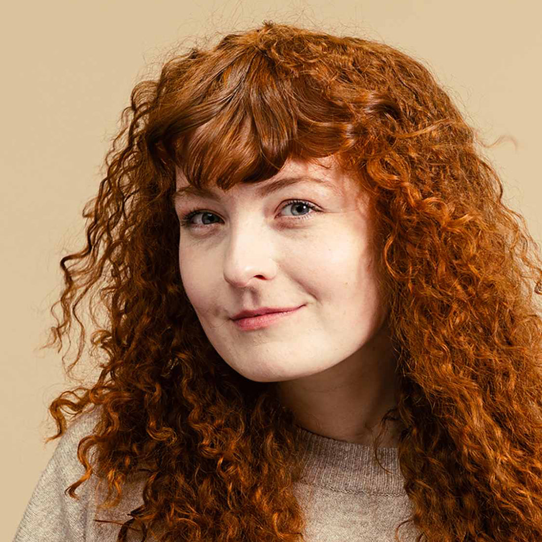 Woman posing and showing off her hair after using Lush&