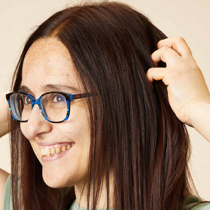 Woman smiling and showing off her hair