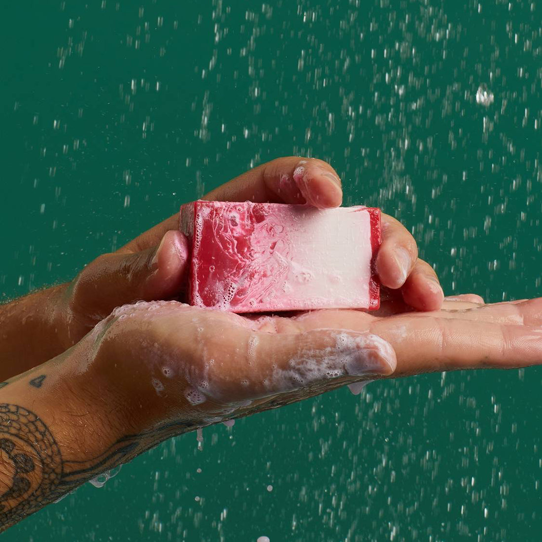 Men holding the pink soup from Lush the Comforter in his hand