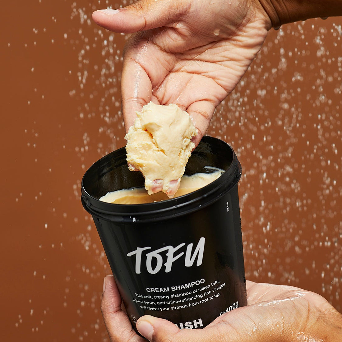 A person holding Lush&