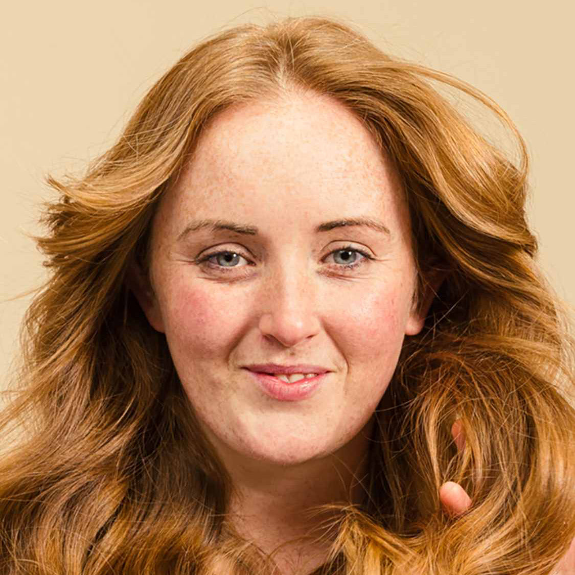 Woman showing off her hair after using Lush&