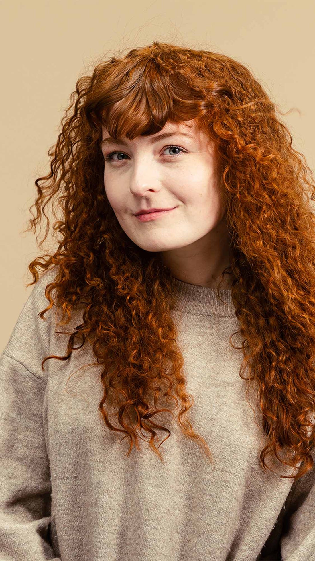 Woman posing and showing off her hair after using Lush&