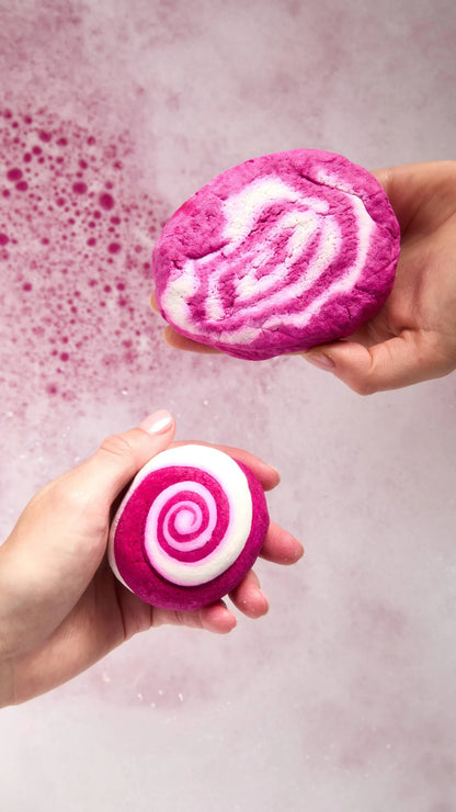 Hands holding two of Lush&