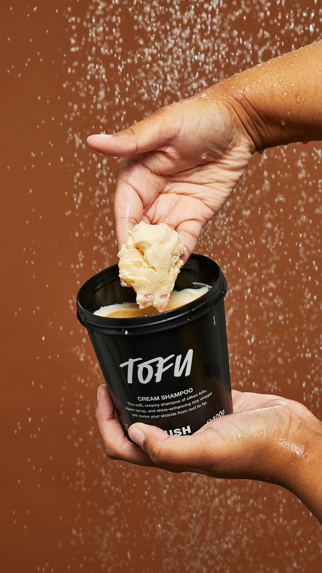 A person holding Lush&