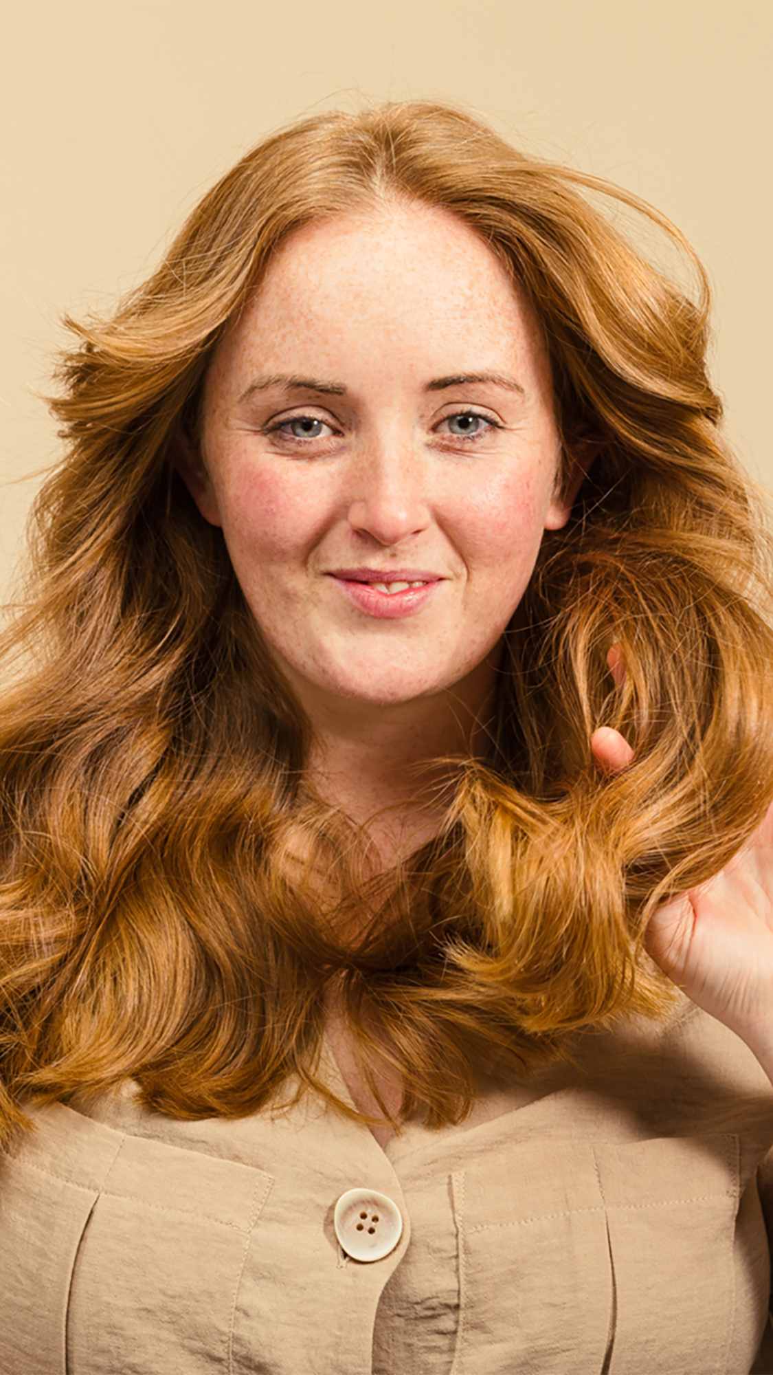 Woman showing off her hair after using Lush&