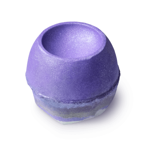 Goddess. A shimmering purple bath bomb, round with a concave carving out of the top. Its base is layered with lilac and grey.